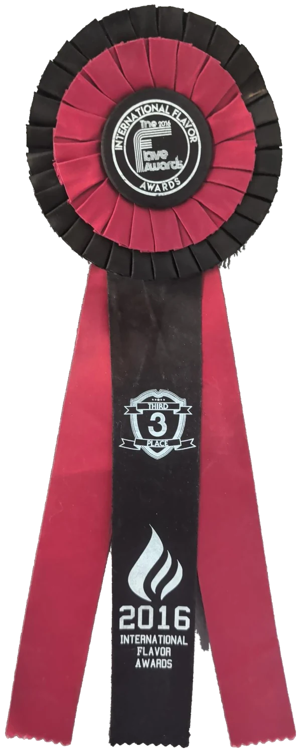 The 2016 International Flavor Awards third-place rosette ribbon in black and magenta, printed "Third Place" and "2016 International Flavor Awards"