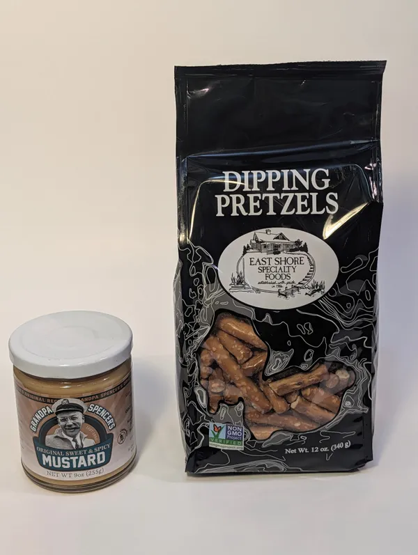 A bag of East Shore Dipping Pretzels next to a jar of Grandpa Spencer's Original Sweet & Spicy Mustard